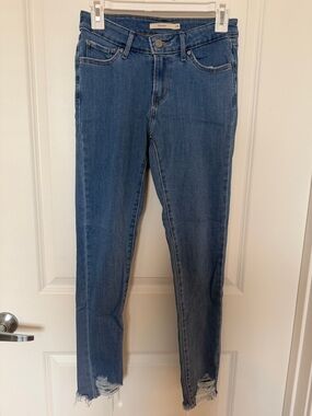 Levi's Midrise Medium Blue Skinny Jeans with Frayed Hem